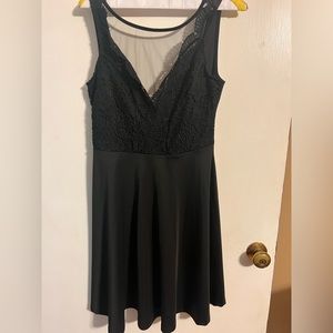 Black dress. Size Medium. Sheer overlay on chest.